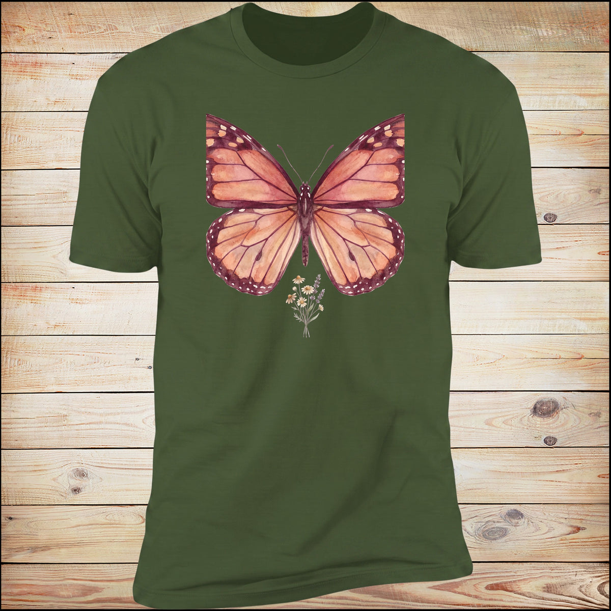 Still Becoming butterfly on moss green tee, wood background
