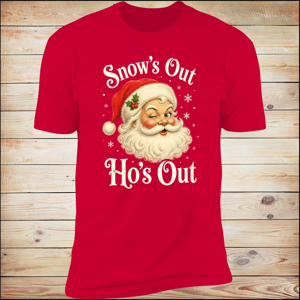 Snow's Out Ho's Out Deluxe Unisex Tee in Red on wood background