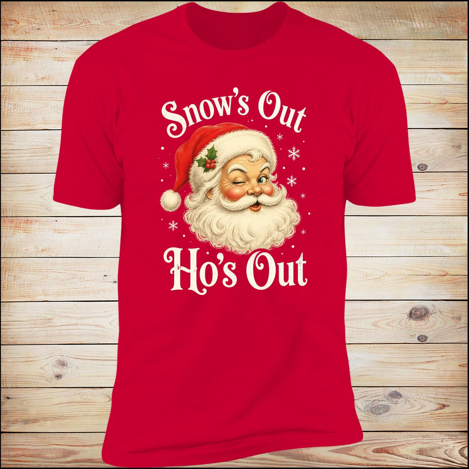 Snow's Out Ho's Out Deluxe Unisex Tee in Red on wood background